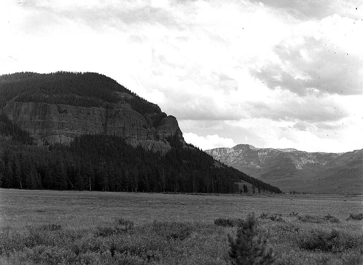 Photographed by Jack Richard in 1953, this black and white image of the Hawk's Rest landmark was one to be duplicated 50 years later for an exhibition featuring the Thorofare. Hawk's Rest is a distinctive mountain overlooking Thorofare Creek, Yellowstone River, and Bridger Lake. MS 89 Jack Richard Photograph Collection, McCracken Research Library. PN.89.20005.1