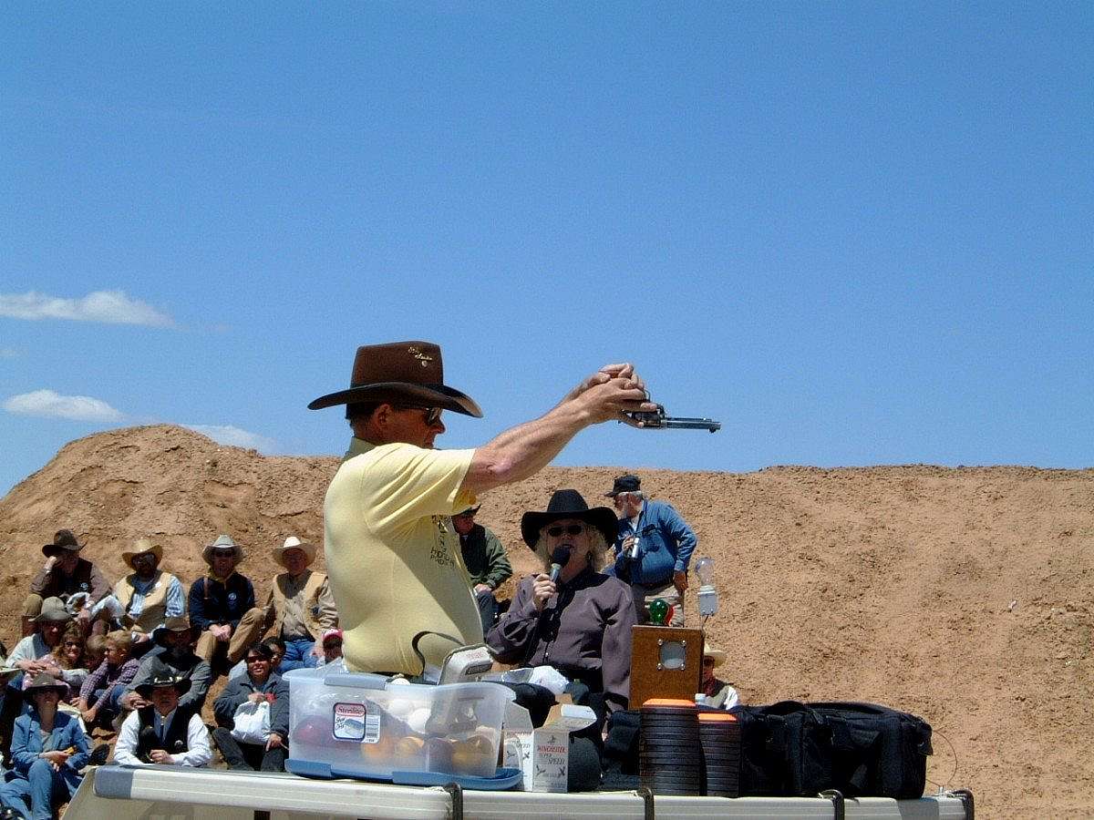 Bob Munden using SAA upsdie down - live ammunition exhibition