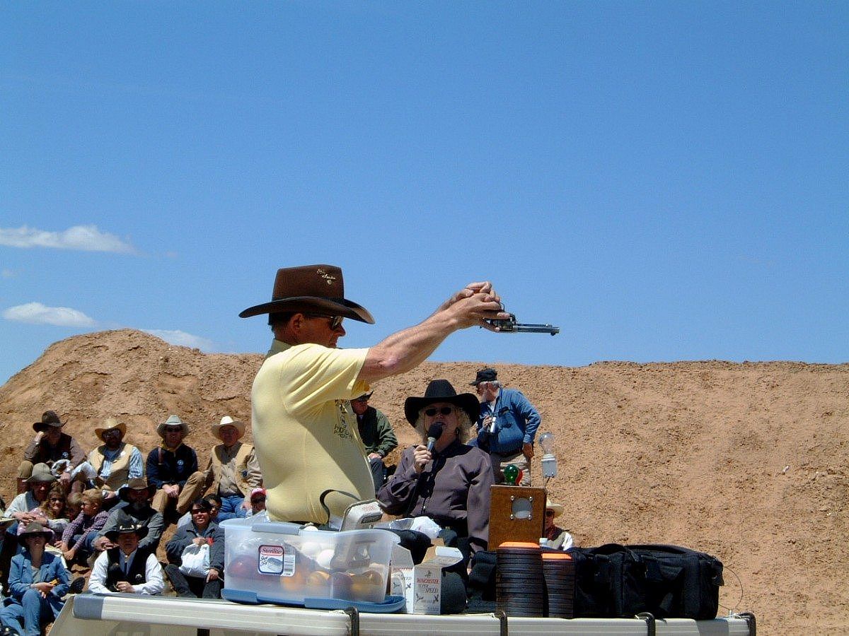 Bob Munden using SAA upsdie down - live ammunition exhibition