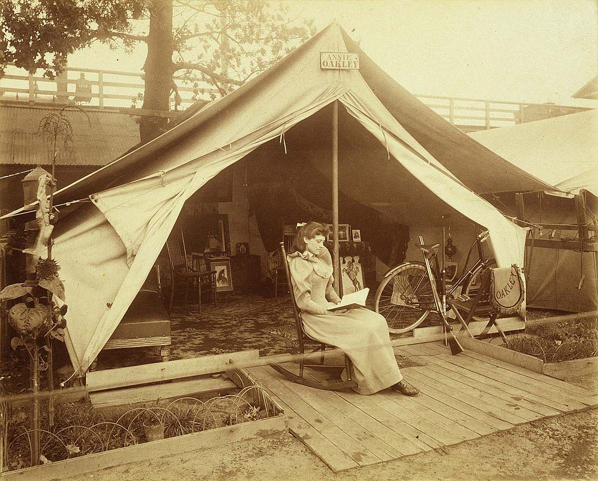 Annie Oakley relaxing at her Wild West tent. MS 6 William F. Cody Collection, McCracken Research Library. P.69.73