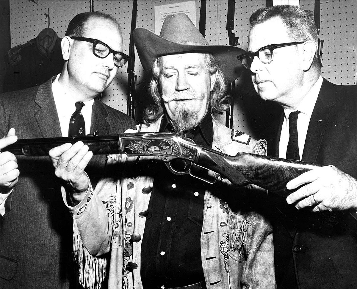 Buffalo Bill's grandson Fred W. Garlow (center) pays a visit to the Winchester Arms Museum in New Haven, Connecticut, while traveling on behalf of the Center in 1968 to appear on the "Today Show" in New York City. He shares his grandfather's Winchester 1873 rifle with Jack R. Peat, vice president of marketing for the Olin Corporation's Winchester-Western Division (left) and Tom Hall, museum curator. P.20.2618