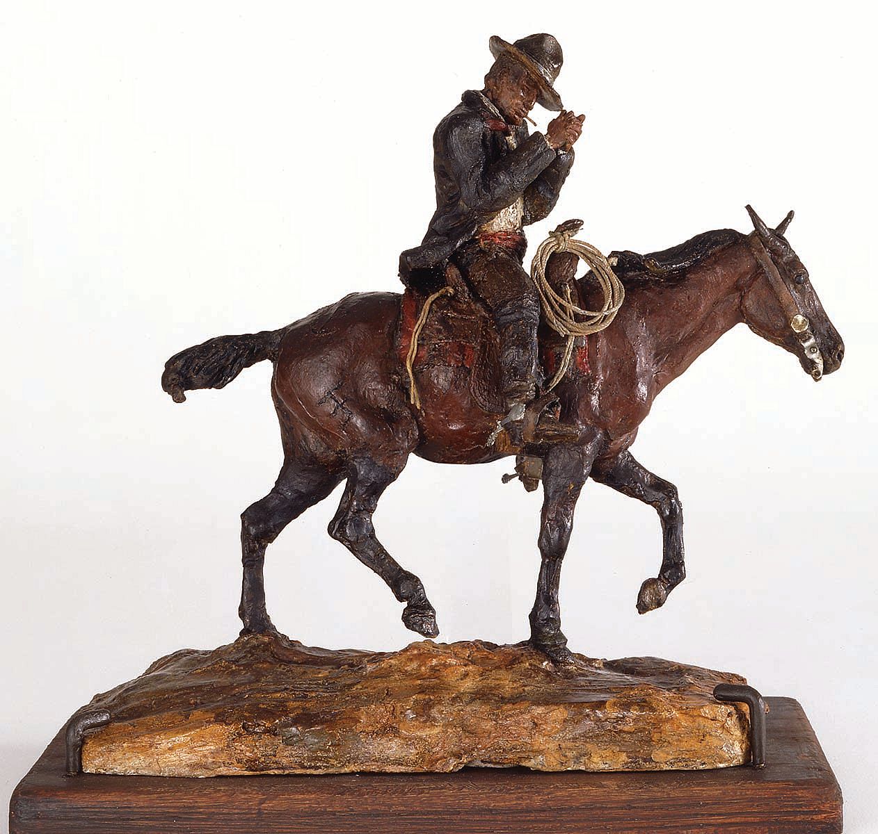 Fig. 8: "On Neenah" (Russell self-portrait), ca. 1897. Painted wax. 9.75 x 4.25 x 9 inches. Gift of Dr. Armand Hammer and Charles Stone Jones. 15.59