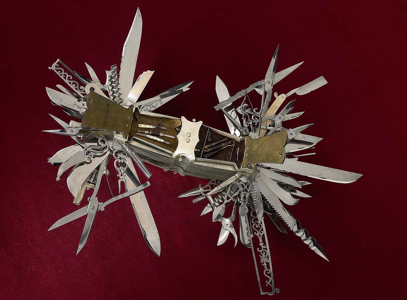 In this view, tortoise shell handle covers are open to reveal the miniature tools contained in the compartments. Multi-bladed folding knife made in Germany ca. 1880 for John S. Holler, cutlery merchant, New York City 1867-1906. Cat. No. 1986.0101.03