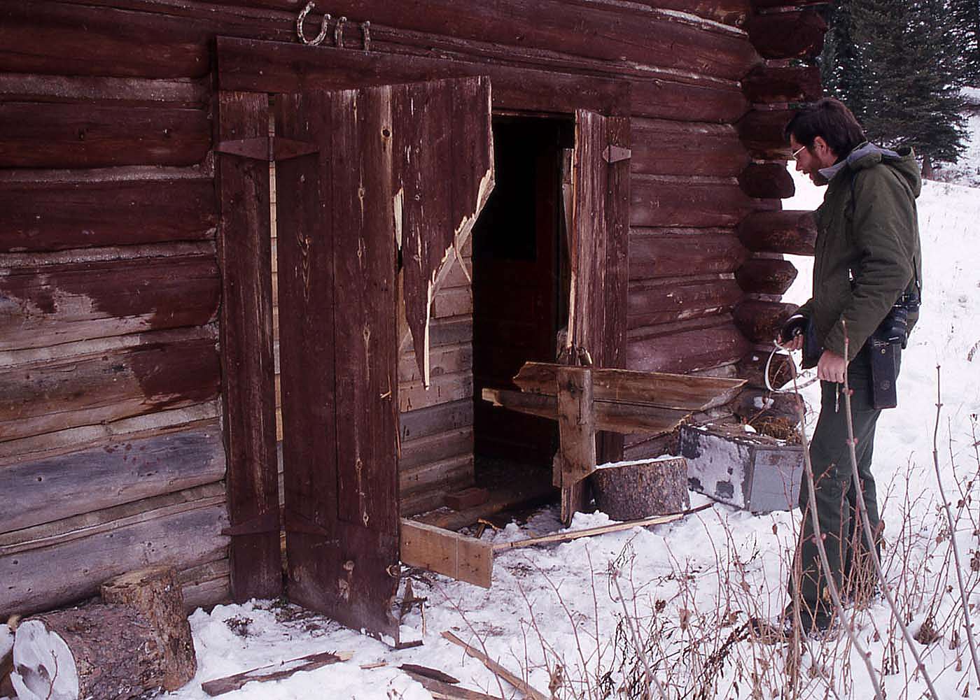 Grizzly damage to Slough Creek scout house in Yellowstone. NPS photo by Jim Peaco, 1989.