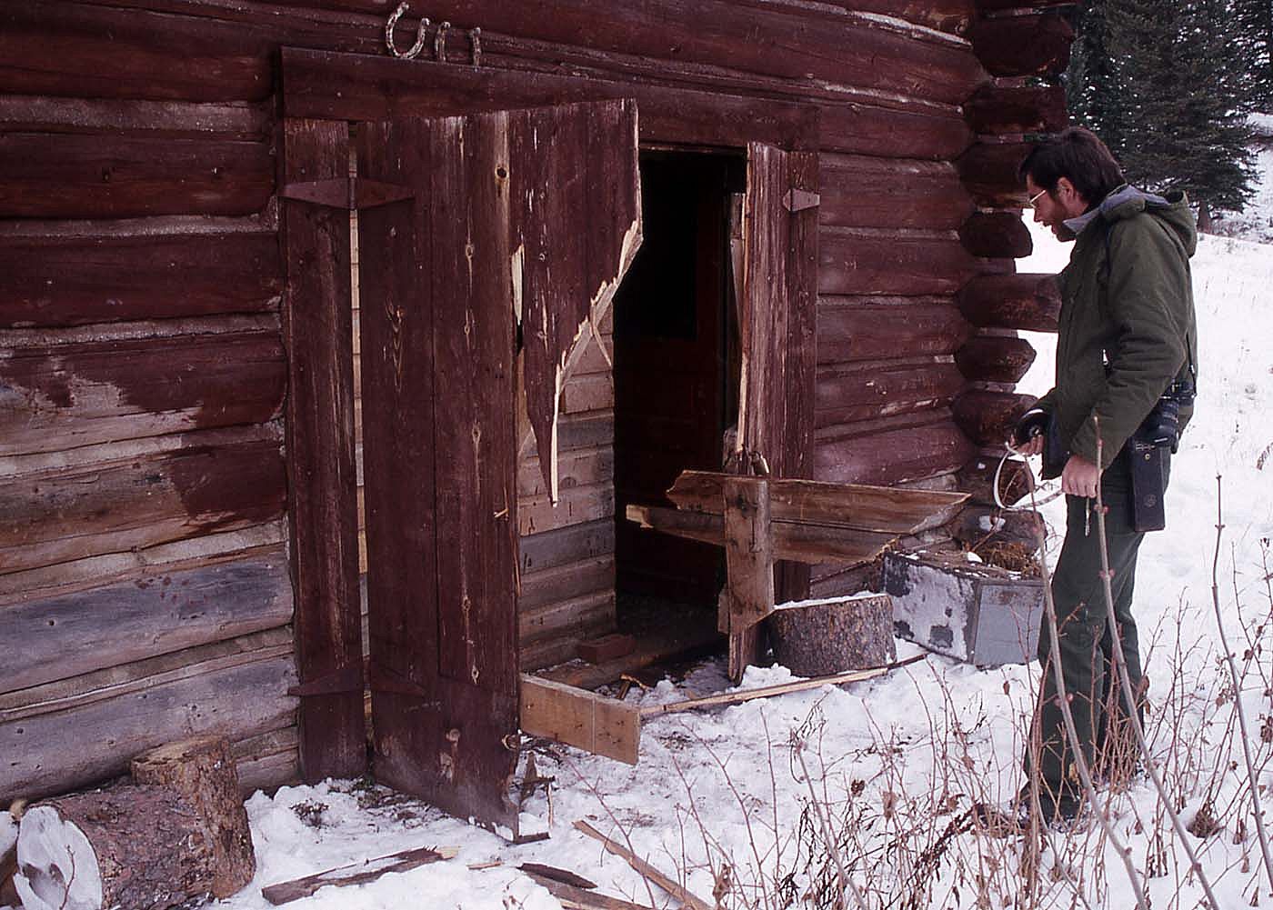Grizzly damage to Slough Creek scout house in Yellowstone. NPS photo by Jim Peaco, 1989.