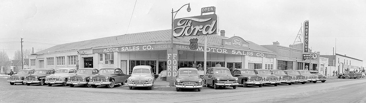 Ford Motor Sales Company at the corner of 14th St. and Sheridan Ave. in Cody, ca. 1950s. MS 89 Jack Richard Photograph Collection, McCracken Research Library. PN.89.118.21512.03-04pan