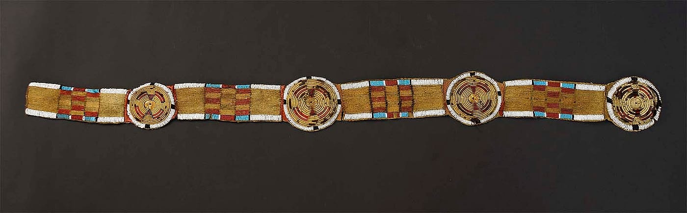 Crow/Nez Perce bison hide, quill wrapped horse hair blanket strip edged in pony and seed beads, ca. 1850. NA.203.1483
