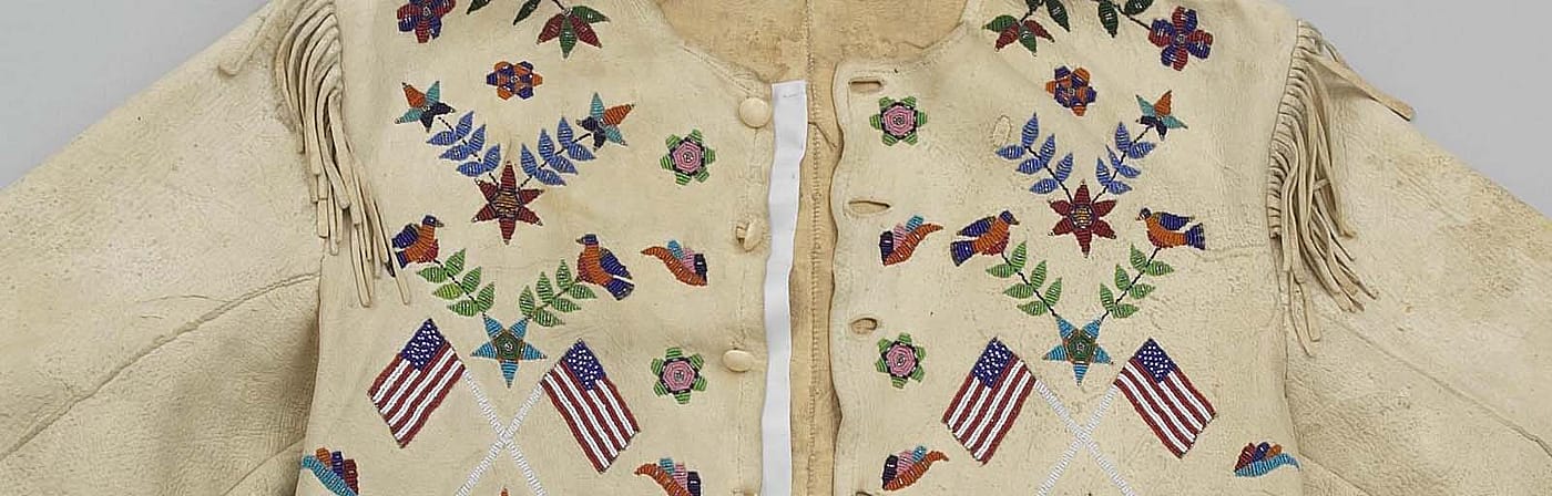 Hide jacket, Santee Sioux, 1920. Gift in memory of Mrs. Ernest R. May, Sr. by her daughter-in-law, Mrs. Ernest R. May, Jr., Woodriver, Wyoming. NA.202.379
