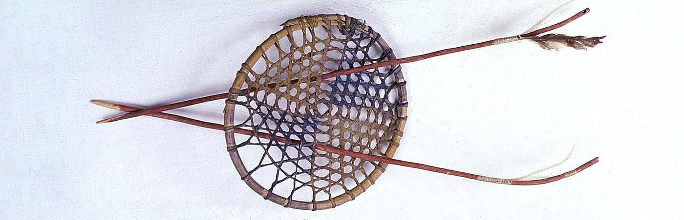 Hoop and arrows. Sioux, Northern Plains. Wood, rawhide thongs, red paint, blue paint, yellow paint, horse hair, and feathers. Royal B. Hassrick Indian Collection. NA.503.5A-C