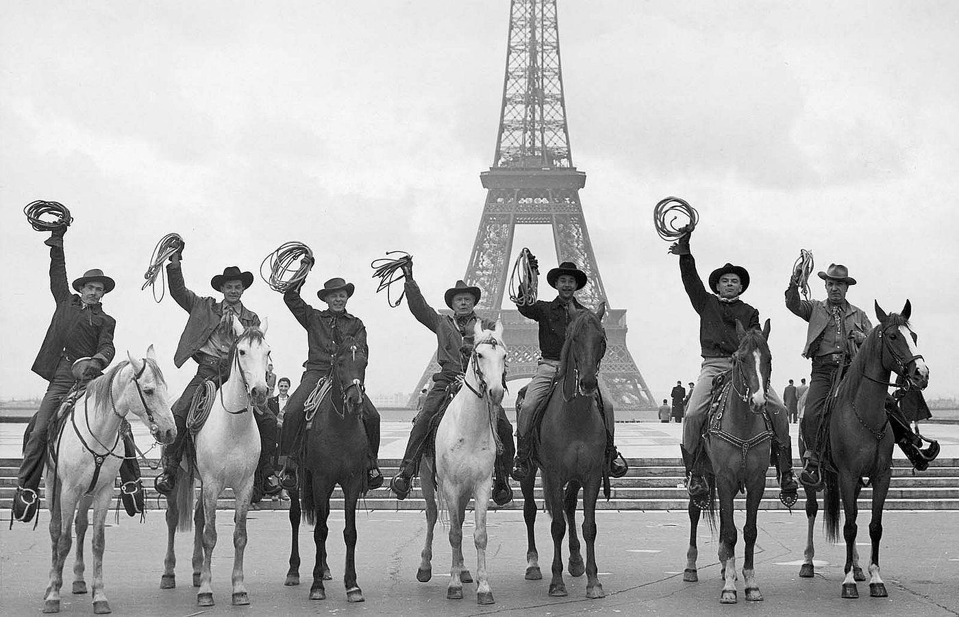 Charles Belden photo of cowboys in front of the Eiffel Tower. P.67.1580 (detail)