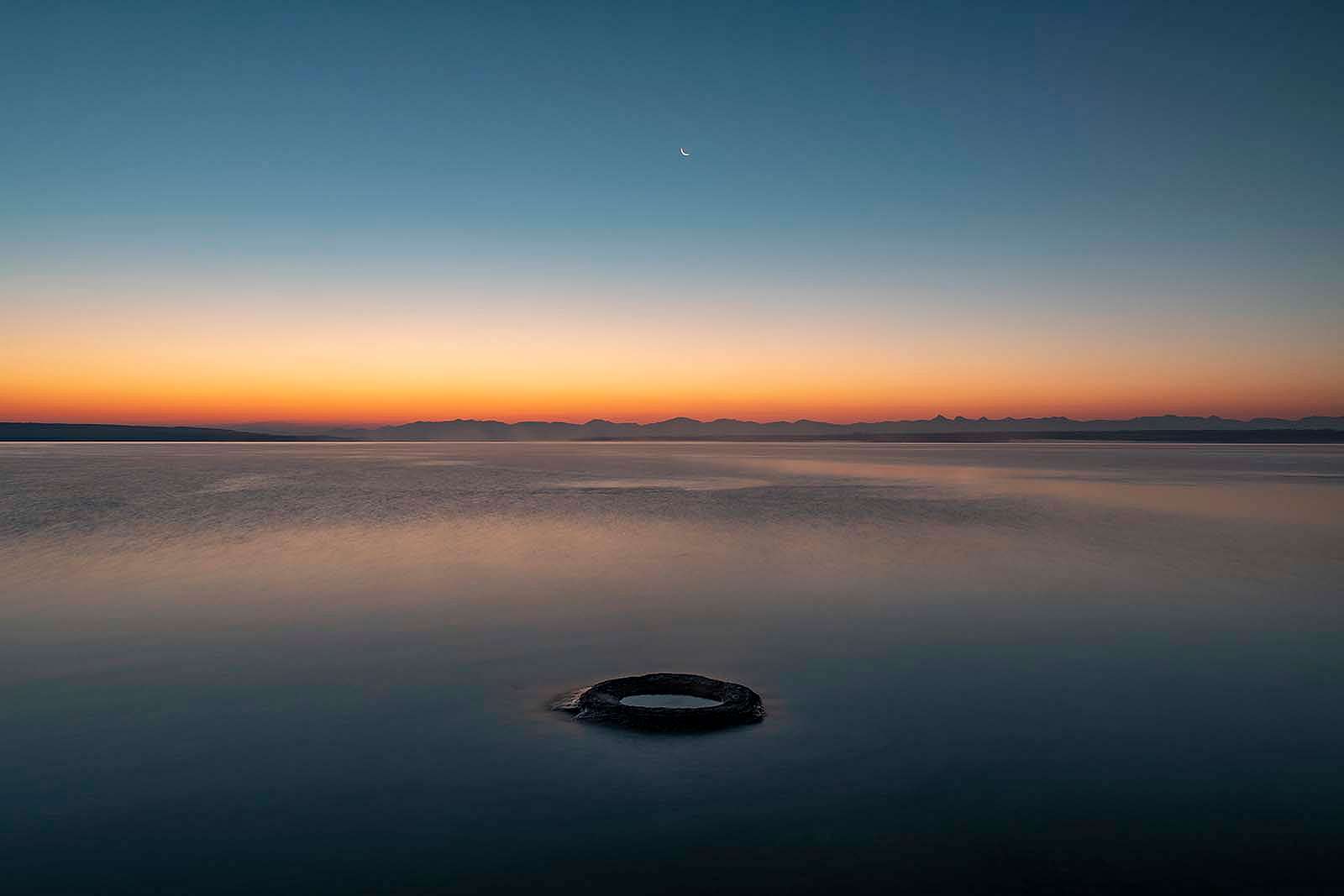 “Fishing Cone.” Fishing cone hot spring, in the West thumb area of Yellowstone Lake, was once a geyser with eruptions as high as 40 feet. As water levels have risen in the lake, the once-active geyser has now fallen silent. What Lies Beneath: Exploring Yellowstone Lake’s Mysterious Vents / Photographs by Chris Linder, Woods Hole Oceanographic Institution.