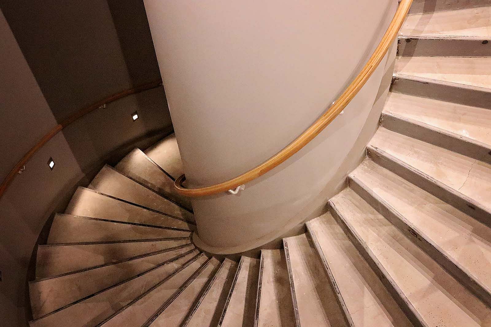 Spiral staircase descending to the lower level in the new Cody Firearms Museum.