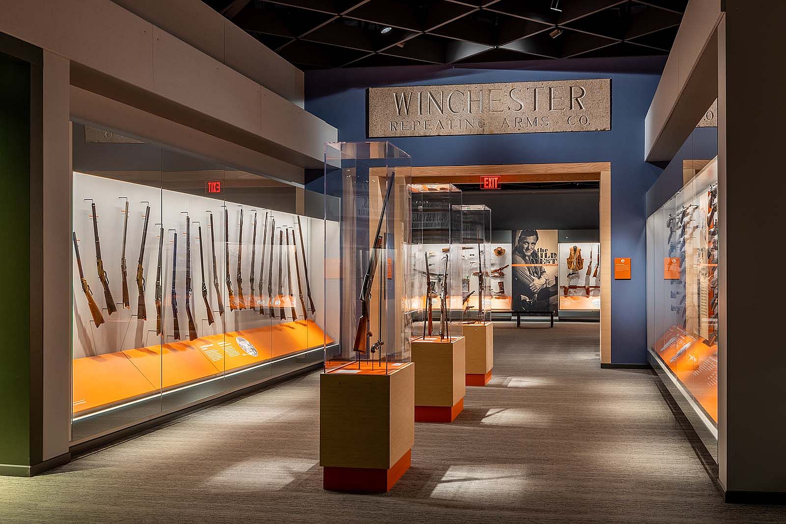 View of Cody Firearms Museum with "Winchester" lintel above displays of firearms.