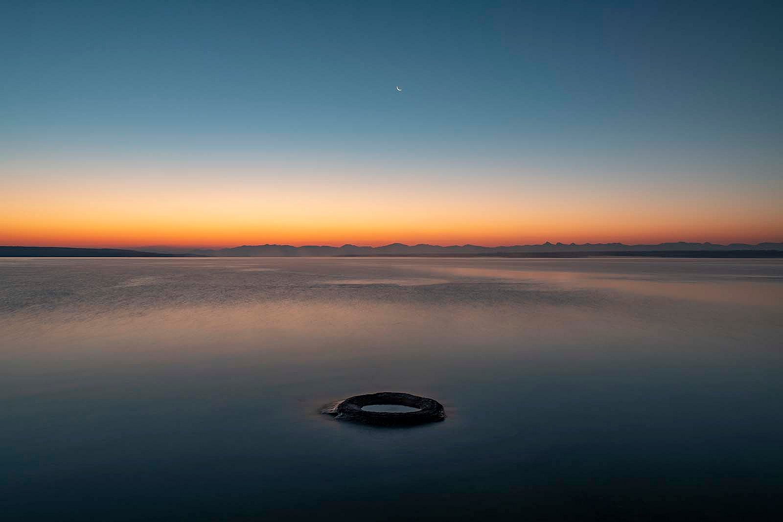 “Fishing Cone.” Fishing cone hot spring, in the West thumb area of Yellowstone Lake, was once a geyser with eruptions as high as 40 feet. As water levels have risen in the lake, the once-active geyser has now fallen silent. What Lies Beneath: Exploring Yellowstone Lake’s Mysterious Vents / Photographs by Chris Linder, Woods Hole Oceanographic Institution.