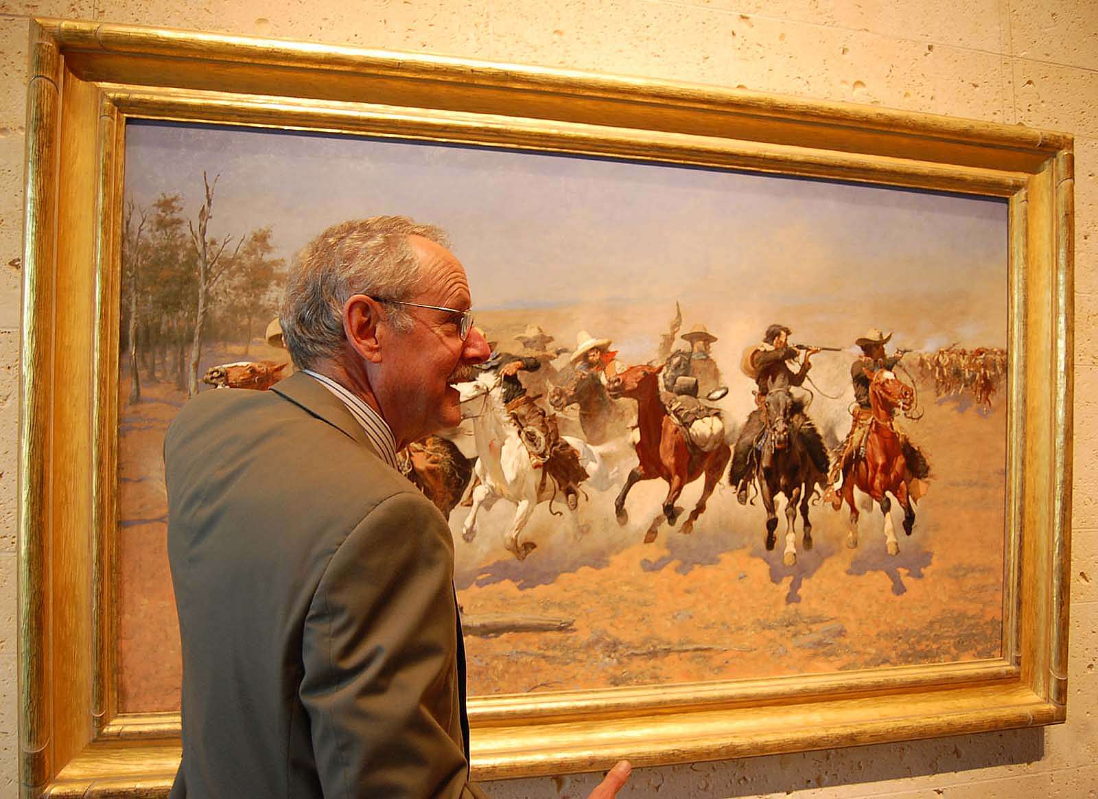 Peter Hassrick with Frederic Remington painting "A Dash for the Timber" at the Amon Carter Museum in Forth Worth, Texas.