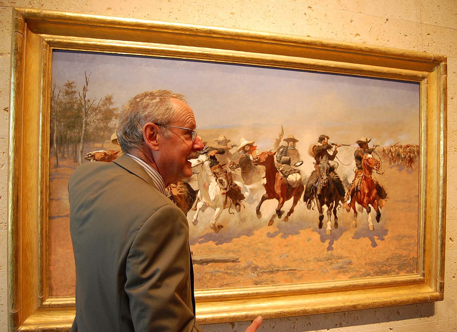Peter Hassrick with Frederic Remington painting "A Dash for the Timber" at the Amon Carter Museum in Forth Worth, Texas.