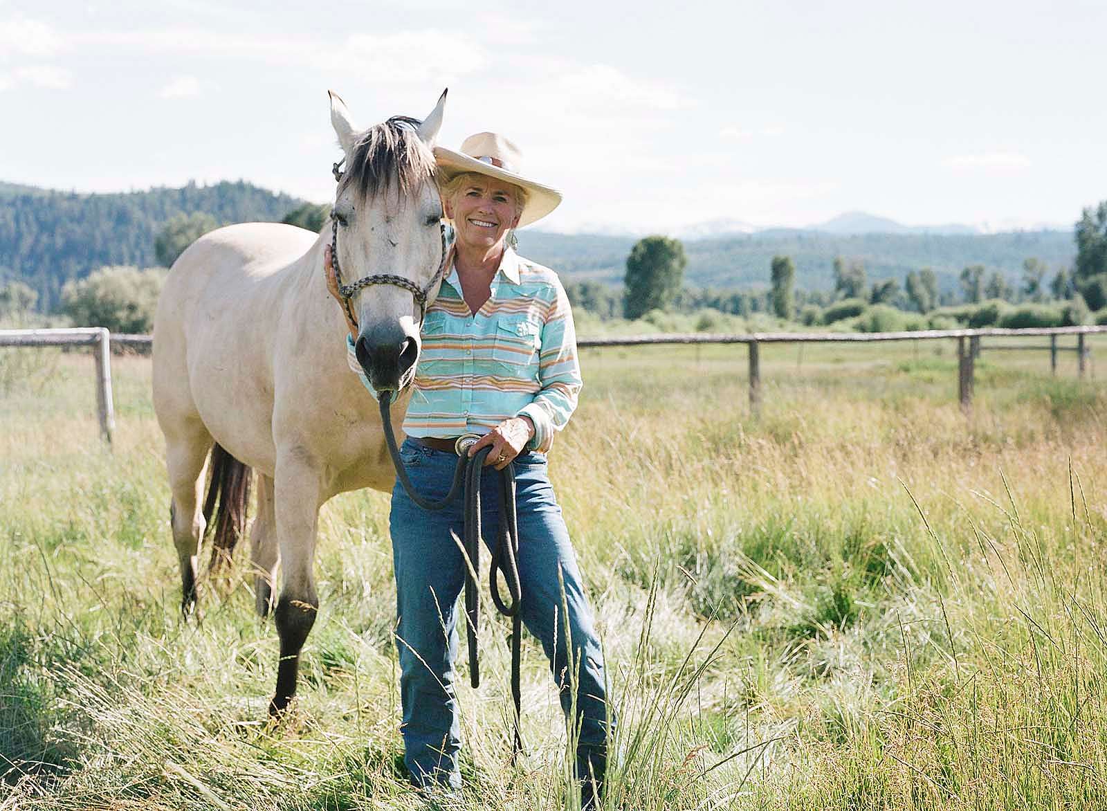 Wyoming's first female Supreme Court Justice, Marilyn Kite, with her buckskin, Cash. Photo by Lindsay Linton Buk.