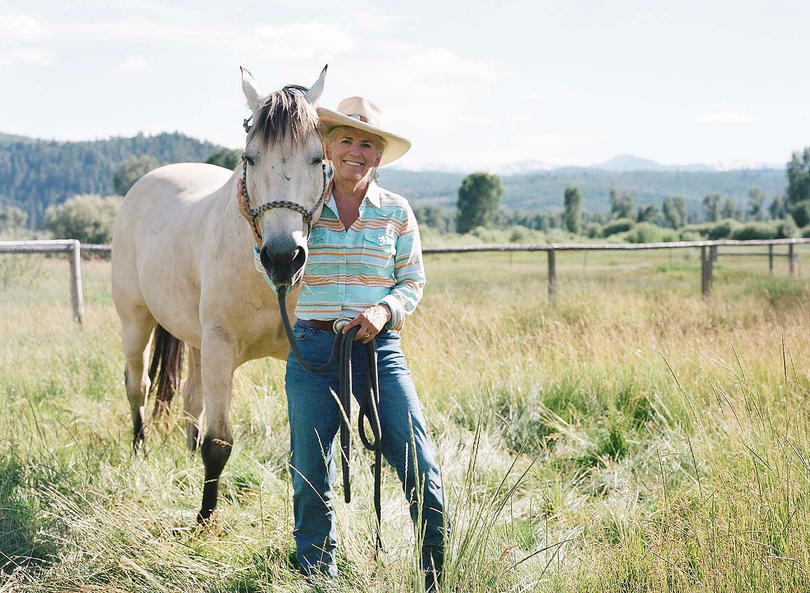 Wyoming's first female Supreme Court Justice, Marilyn Kite, with her buckskin, Cash. Photo by Lindsay Linton Buk.