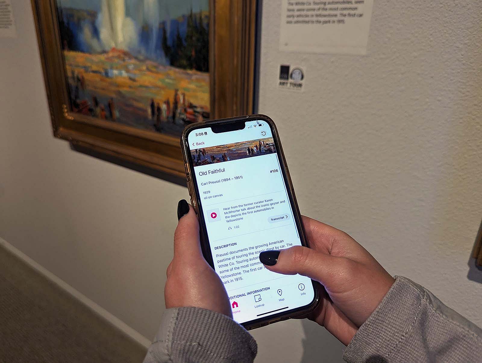 A visitor using the Bloomberg Connects digital guide on a smart phone in our Whitney Western Art Museum.
