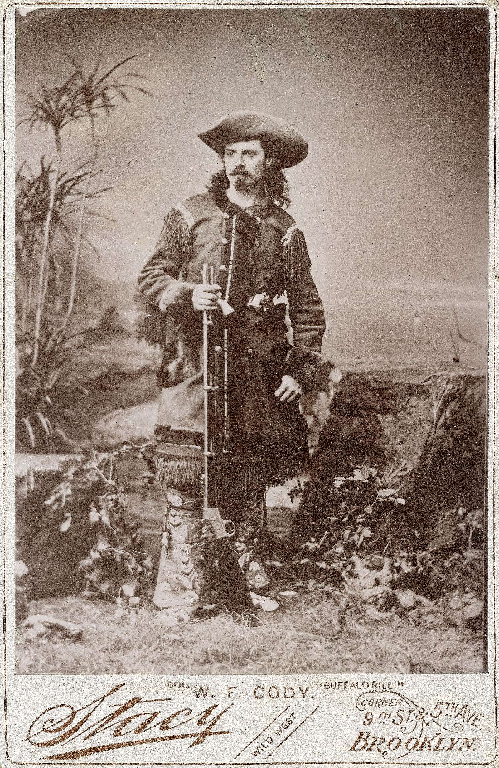 Photograph, William F. "Buffalo Bill" Cody in fringed buckskin with rifle, ca. 1870 - 1880. Studio portrait by Stacy. Buffalo Bill Center of the West, Cody, Wyoming, USA. MS 6 William F. Cody Collection, McCracken Research Library. P.6.0156 (BBCW-WFC01-P.69.0156)