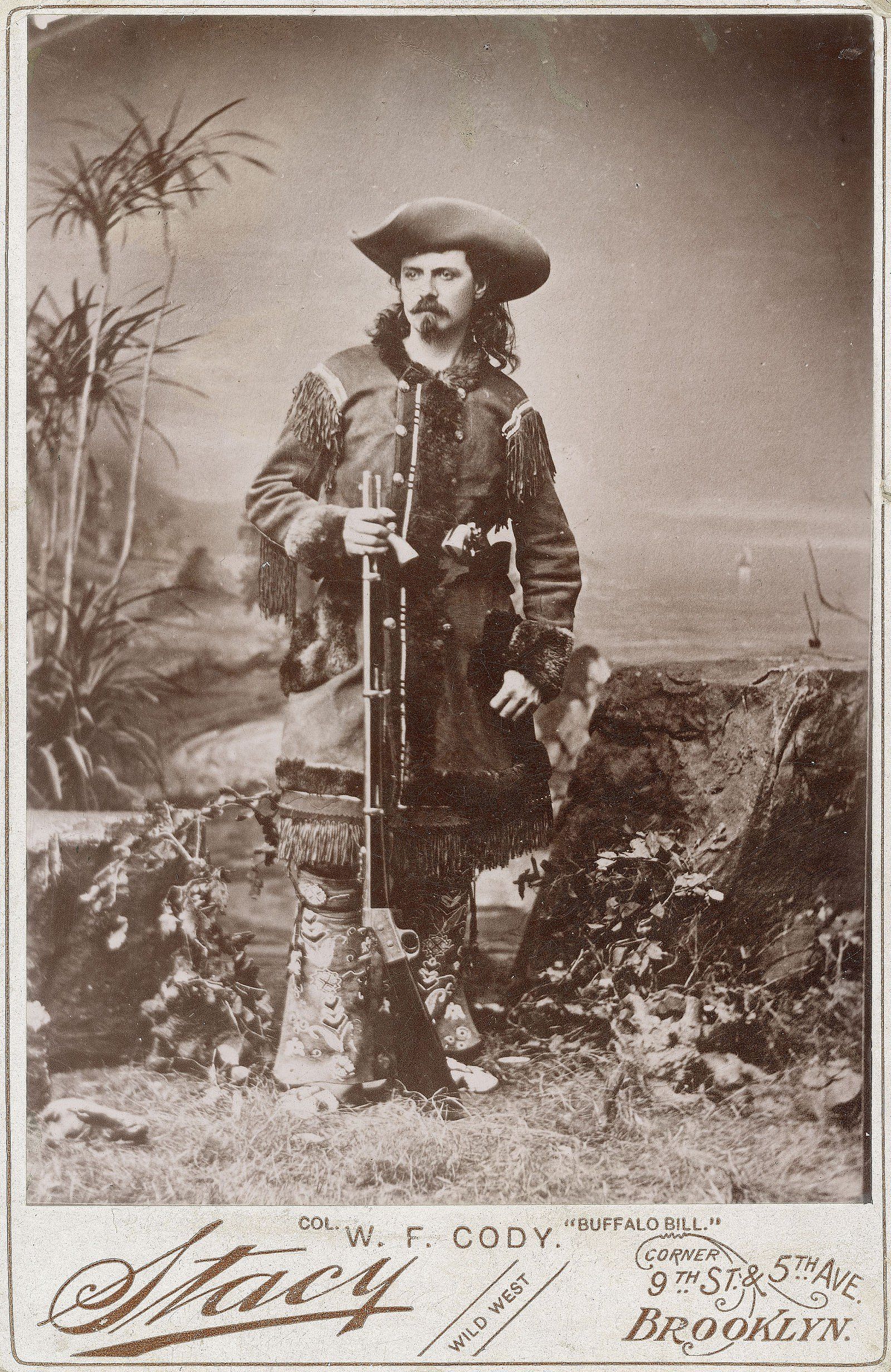 Photograph, William F. "Buffalo Bill" Cody in fringed buckskin with rifle, ca. 1870 - 1880. Studio portrait by Stacy. Buffalo Bill Center of the West, Cody, Wyoming, USA. MS 6 William F. Cody Collection, McCracken Research Library. P.6.0156 (BBCW-WFC01-P.69.0156)