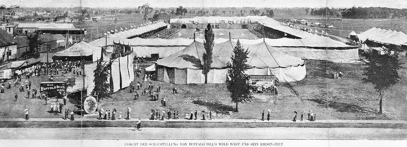 Black and white photo, view of Buffalo Bill's Wild West arena in Germany, show and entrance tents, ticket wagon, and spectators entering. MS 6 William F. Cody Collection, McCracken Research Library. P.69.1512