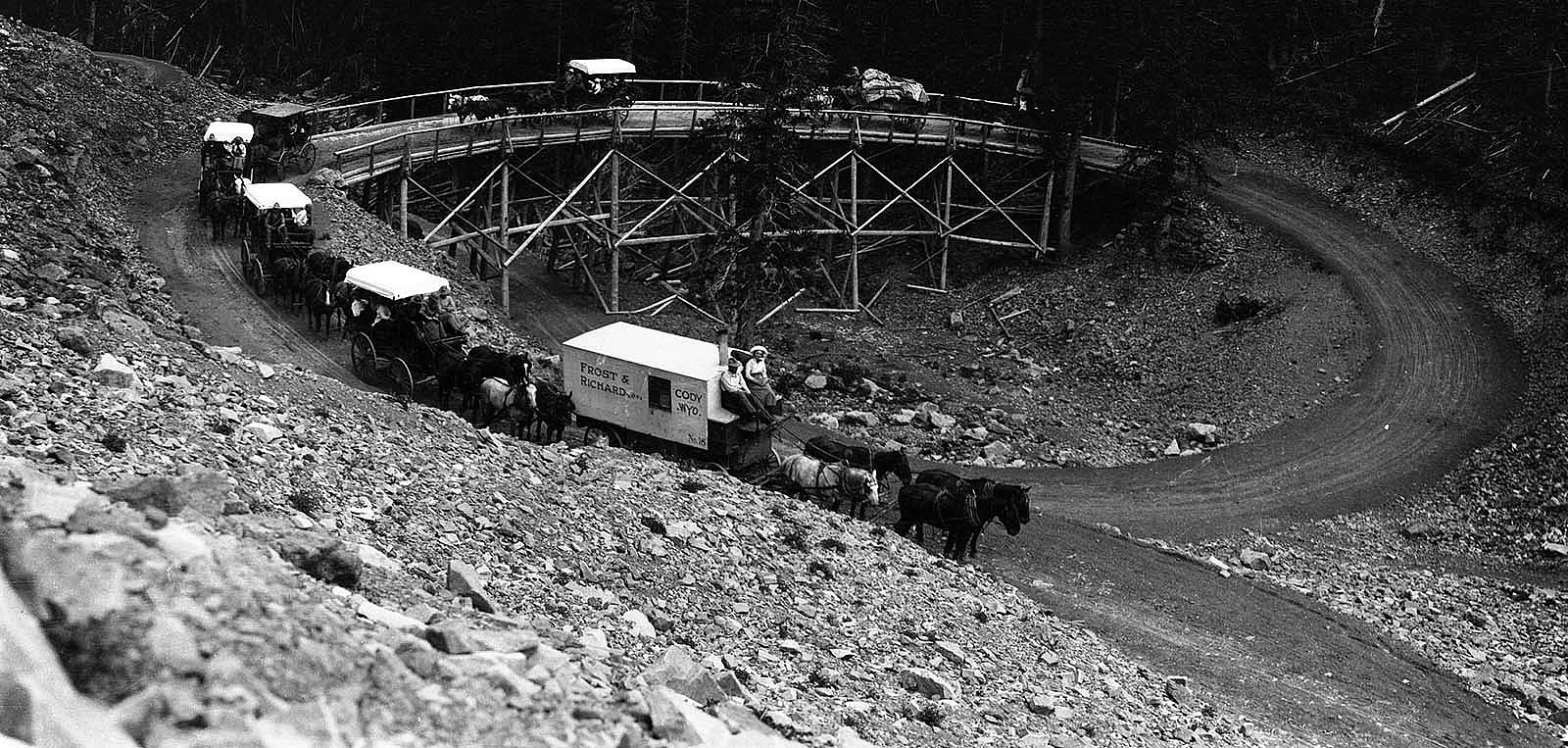 A Frost & Richard tour group headed up Sylvan Pass and over the original wooden corkscrew bridge