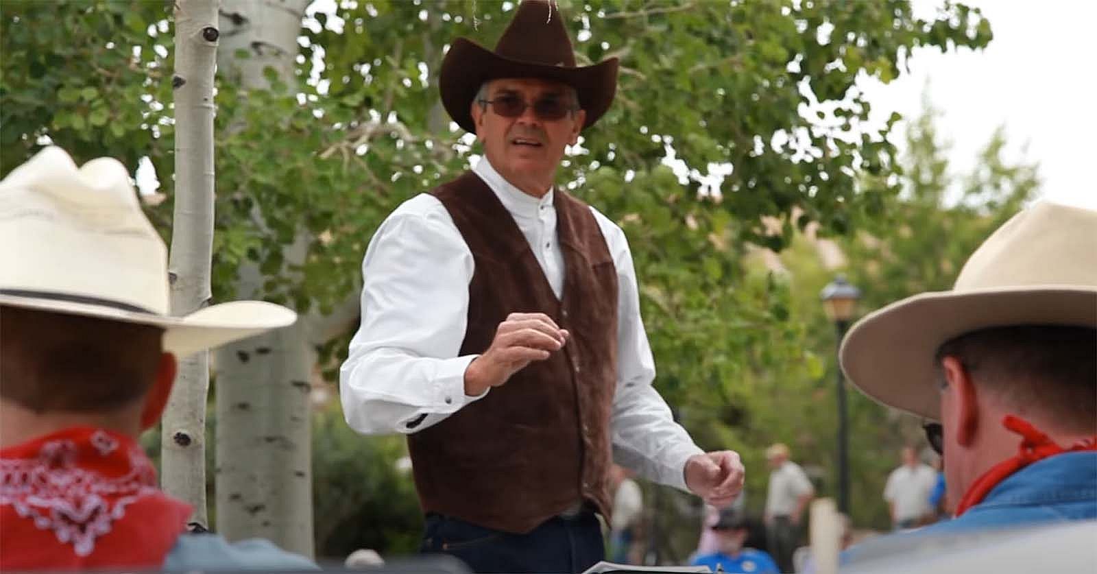 Mike Masterson conduct the modern Buffalo Bill's Cowboy Band at an outdoor event at the Buffalo Bill Center of the West.