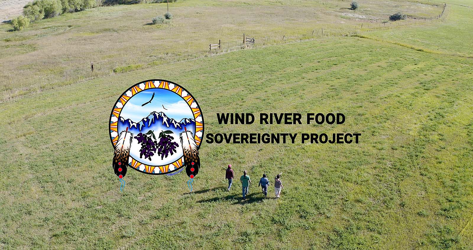 Aerial view of four people walking through green field. Logo and text for Wind River Food Sovereignty Project.