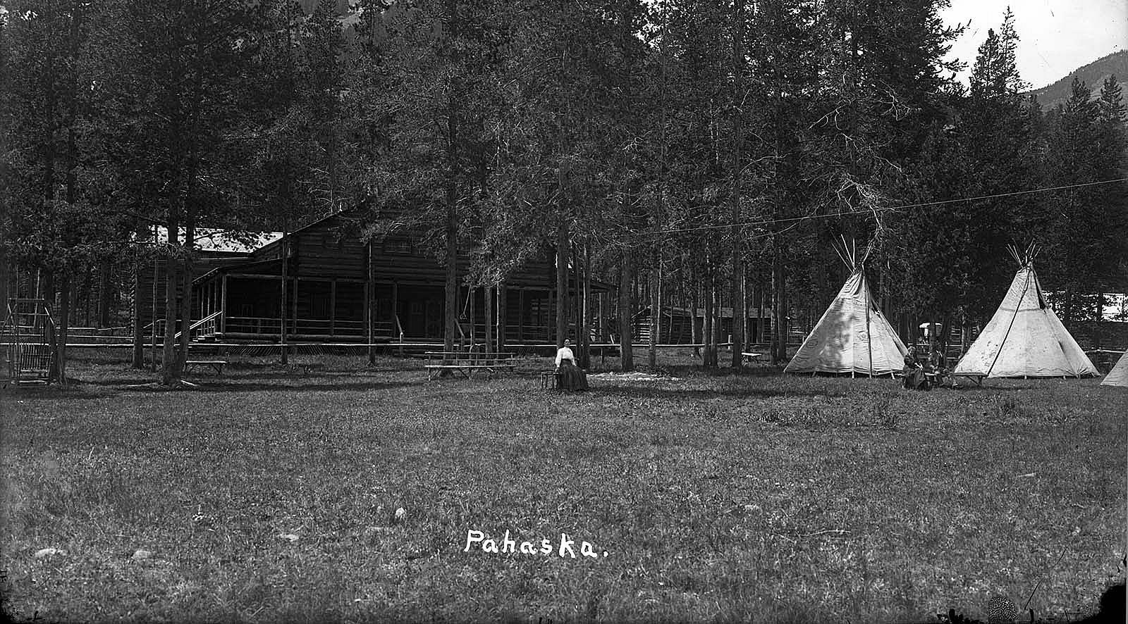 Pahaska tepee with tipis and people sitting in front., ca. 1905-1920. F.J. Hiscock photo. MS 228 Buffalo Bill Museum Photographs Collection. PN.228.328
