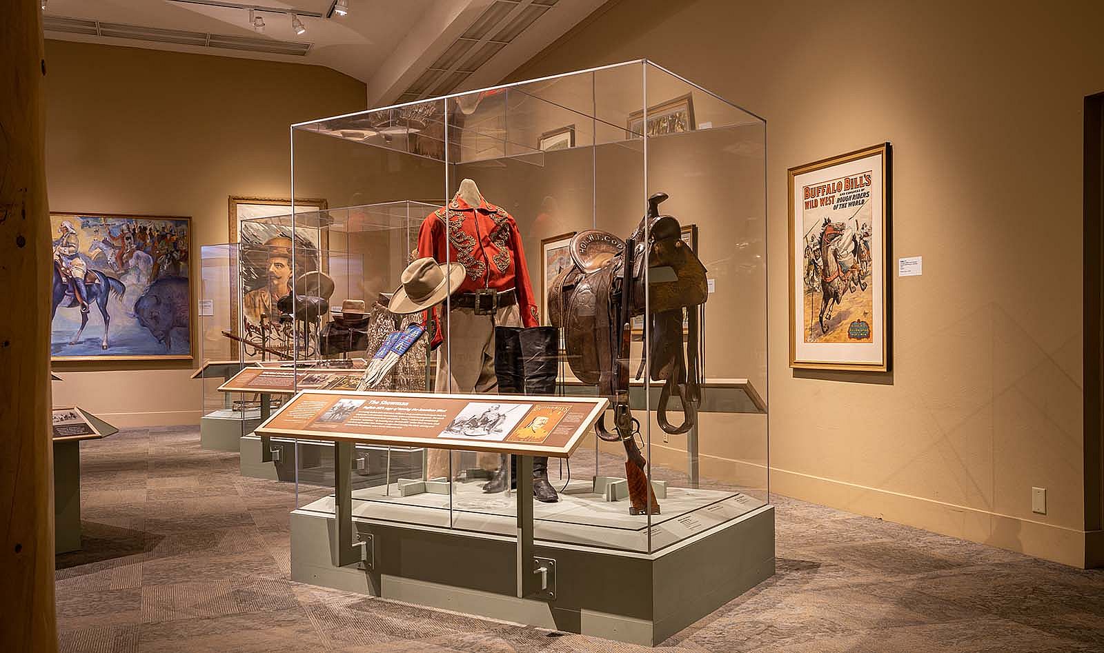 Buffalo Bill Museum with "The Showman" case displaying shirt, hat, saddle from Buffalo Bill's show career.