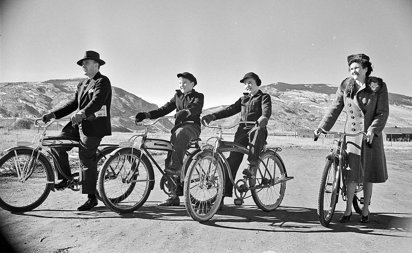 Milward and Lorna Simpson with sons Al (left) and Pete, and Shoshone River Canyon in the background. The monument was right of this photo, demonstrating how the area has changed. PN.89.107.21020.02.1