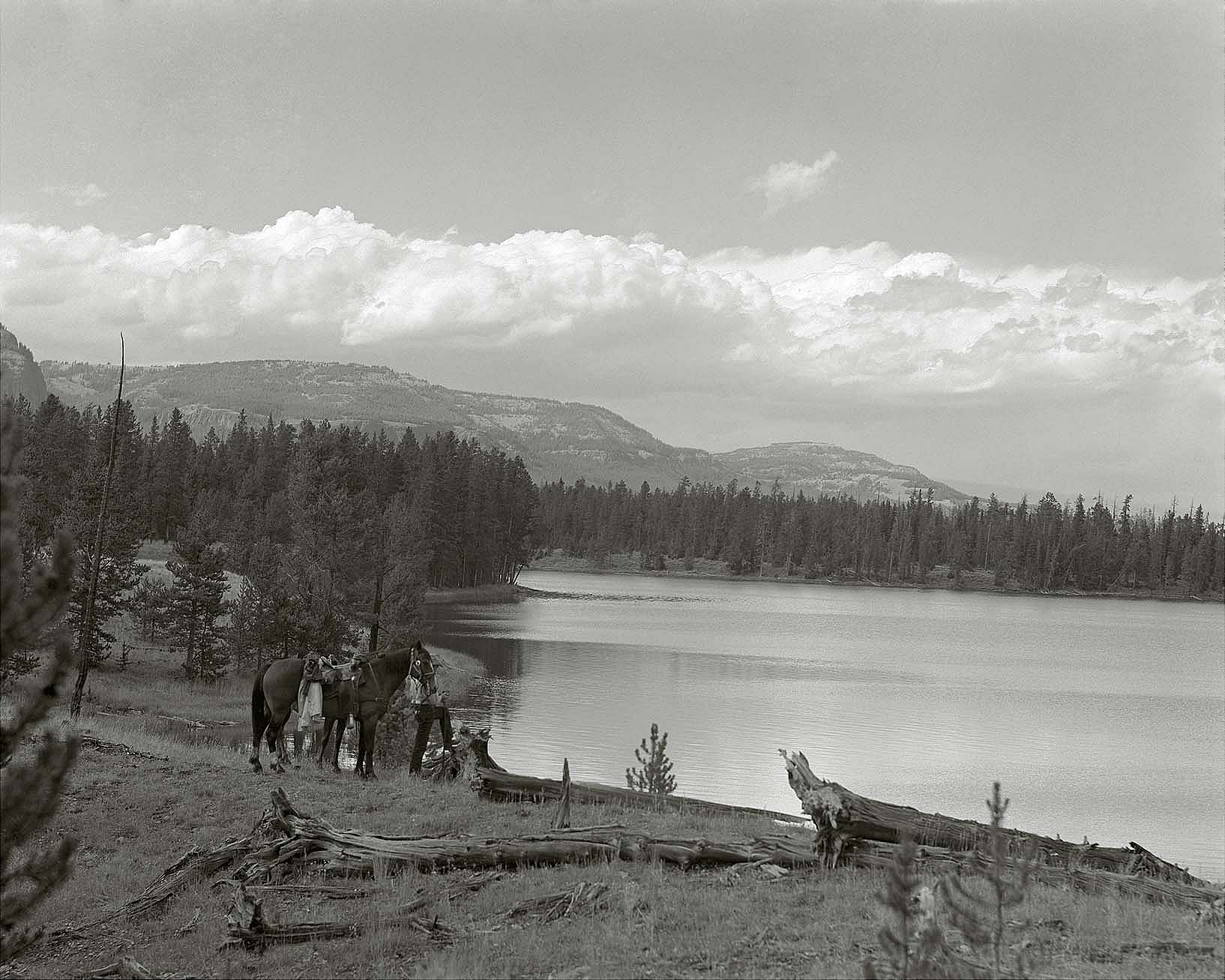 The western shoreline of Bridger Lake in 1953. The mountains of Two Ocean Plateau in the background are part of the continental divide. Jack Richard photograph. MS 89 Jack Richard Photograph Collection, McCracken Research Library. PN.89.20005.5