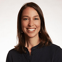 Women with shoulder-length hair in black shirt.