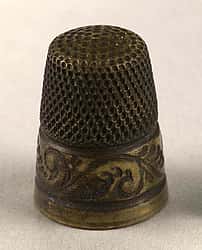 Louisa Cody's brass thimble. Museum purchase, Garlow Collection. 1.69.184.28