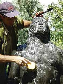 Andrew Breidenbach washing "Buffalo Prayer." James Earle Fraser (1876-1953). "Buffalo Prayer," modeled ca. 1917, copyrighted 1931, cast posthumously 1968. Cast 1/2 by Modern Art Foundry, New York, N.Y. Bronze, 107.5 inches. Gift of William E. Weiss. 51.72