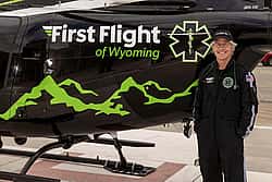 Tom Fitzsimmons with First Flight helicopter