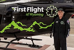 Tom Fitzsimmons with First Flight helicopter