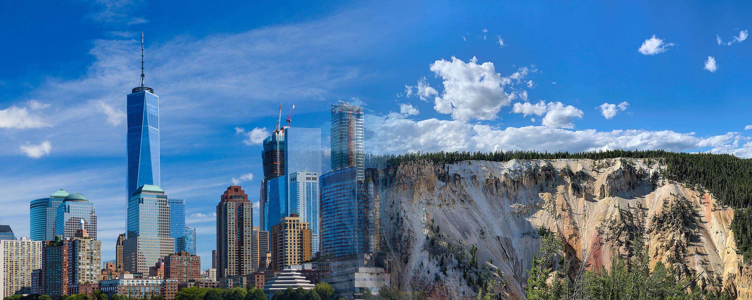 A Photoshopped image of the NYC skyline (urban skyscrapers) blending into the Wyoming skyline (mountain lanscape).