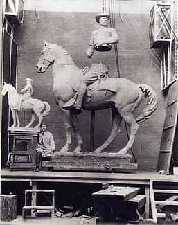 Alexander Phimister Proctor in his studio with the sculpture, Rough Rider, 1922.