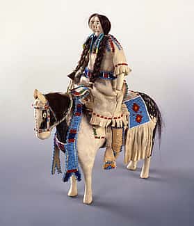 Northern Plains doll and horse, ca. 1900. Constructed of cloth, tanned deer hide, beads, horse hair, and pigment. Gift of Ms. Lucile M. Wright. NA.507.18