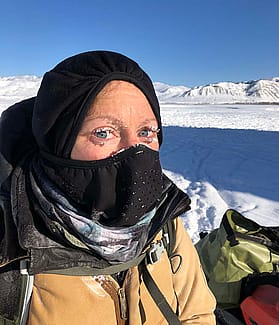 Kristin Barker dress for cold weather with frosty eyelashes. Snow in the background. Mark Gocke photo.
