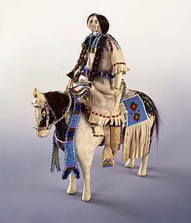 Northern Plains doll and horse, ca. 1900. Constructed of cloth, tanned deer hide, beads, horse hair, and pigment. Gift of Ms. Lucile M. Wright. NA.507.18