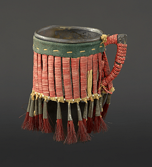 Cup, Lakota (Sioux), Northern Plains, ca.1900. Metal, rawhide, tin cones, glass beads, porcupine quills, tanned hide, wool cloth, cotton thread, dyed horse hair; NA.506.146. Courtesy of the Plains Indian Museum.