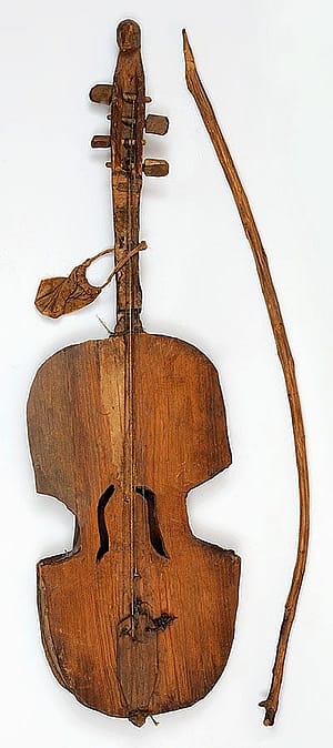 Wooden fiddle and bow, ca. 1890. Gift of the Coe Foundation. 1.67.196A&B