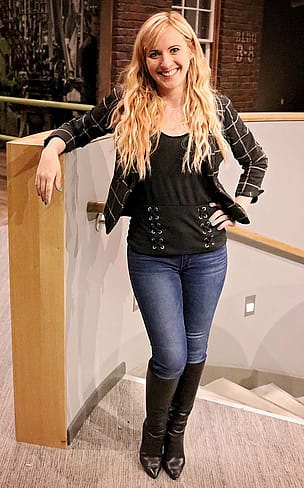 Ashley Hlebinsky at the top of the spiral stairway as the new Cody Firearms Museum nears completion.