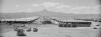 Jack Richard photo, 1952. View of Heart Mountain Relocation Center barracks. MS 089 Jack Richard Photograph Collection. P.89.111.21236.05-N