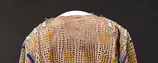 Punctured shirt. ca. 1850. The Paul Dyck Plains Indian Buffalo Culture Collection, acquired through the generosity of the Dyck family and additional gifts of the Nielson Family and the Estate of Margaret S. Coe. NA.202.1209