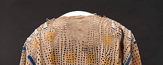 Punctured shirt. ca. 1850. The Paul Dyck Plains Indian Buffalo Culture Collection, acquired through the generosity of the Dyck family and additional gifts of the Nielson Family and the Estate of Margaret S. Coe. NA.202.1209