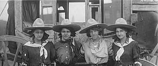 Four Cowgirls in Front of Stagecoach, 101 Ranch Show, ca. 1916. Sepia toned photograph. MS 6 William F. Cody Collection. P.69.1289 (detai)